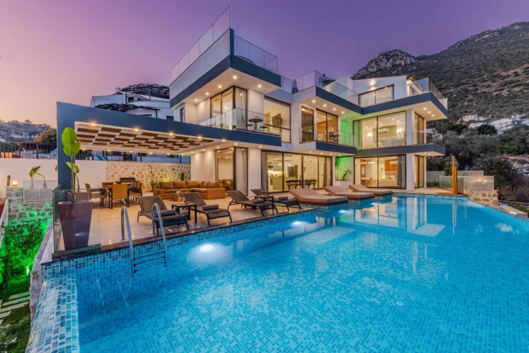 Luxurious mansion overlooking a pool by the mountain side
